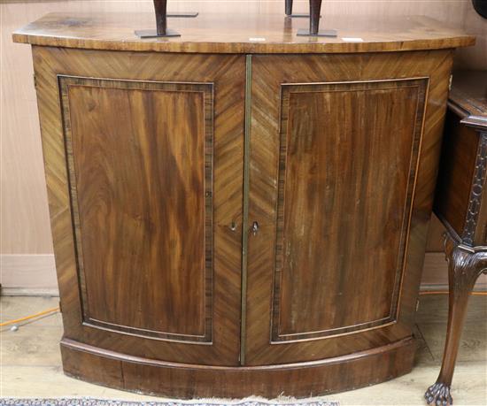 A Regency mahogany bowfront cupboard W.103cm